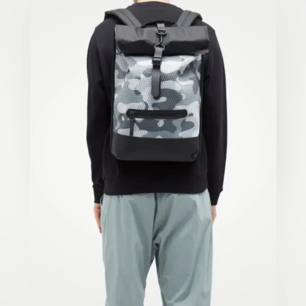 New Rains Black and Gray Unisex camo look Backpack.